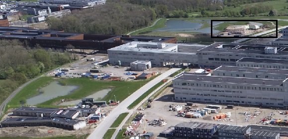 Bygningen til den kommende kræftrådgivning i Odense ved siden af det nye OUH er markeret på et dronefoto